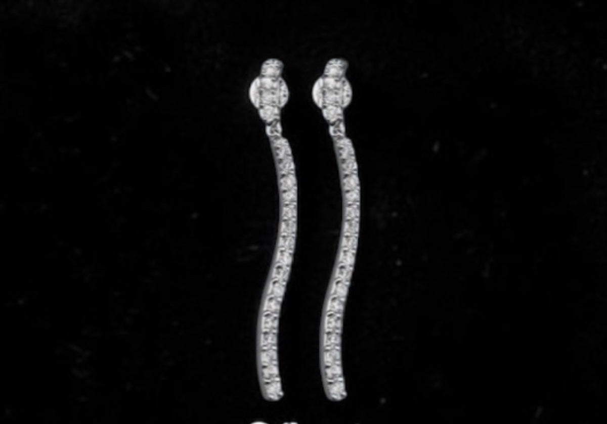 CURVY TENNIS EARRINGS IN SIMULATED DIAMONDS