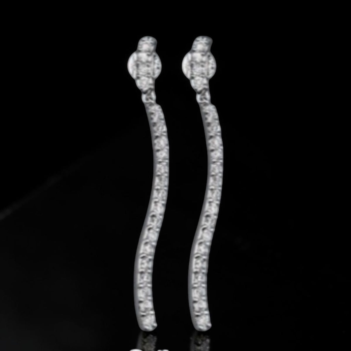 CURVY TENNIS EARRINGS IN SIMULATED DIAMONDS