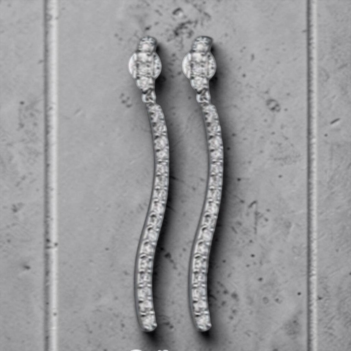 CURVY TENNIS EARRINGS IN SIMULATED DIAMONDS