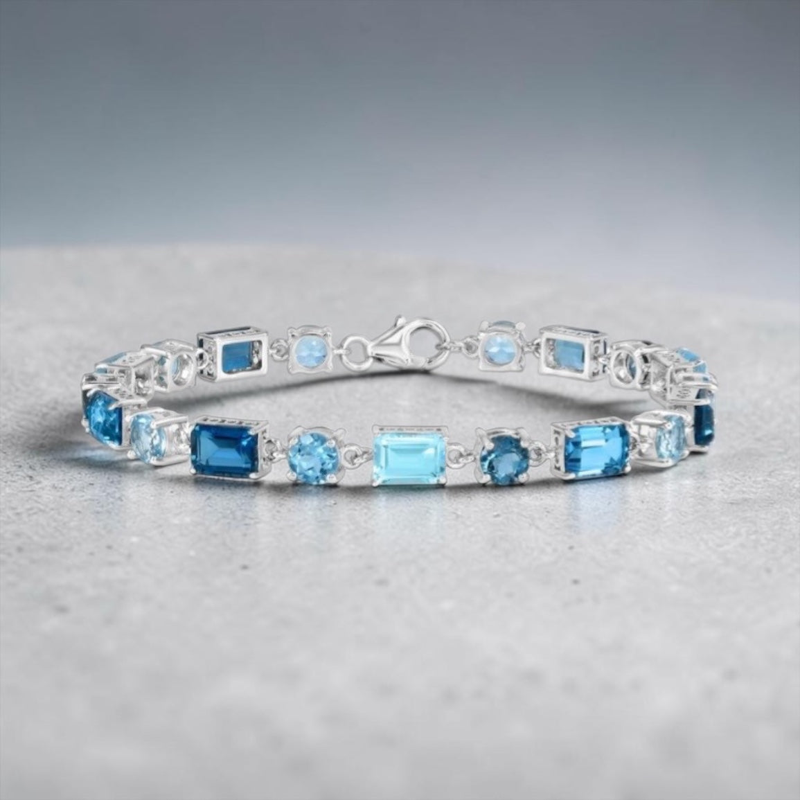 Sterling Silver Round & Emerald-Cut 17.05cttw Gem Bracelet - Swiss, London, & Sky Blue Topaz
